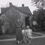 Beda Ekburg with two young ladies in her babysitting charge at her home on 3rd Ave., Durango, Colorado. Circa 1946-47