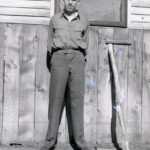 Edwin Ekburg at their home on 3rd ave., Durango Colorado, shortly after discharge from army. Circa 1945-46 Notice army "low-quarter shoes and brass belt buckle.