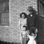 Edwin Ekburg with his wife Freda, son Charles and daughter Carol at the "Graces" rental house. This house was the original May Day school house moved to this location just 1/2 mile west of Durango on Highway 160.