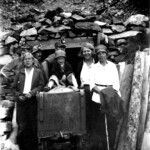 Verner in front of two unknown miners, Arvid sr. & Arvid jr., Elvira Alexander (Arvid's wife) and Mae, Signe's daughter.