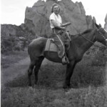 Evelyn Ekburg horseback in Colorado Springs, Colorado. Circa 1943-44