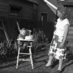 Evelyn (Ekburg) Asher with her favorite nephew "Little Charlie" on his first birthday. Circa July 1949