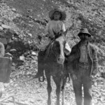 Gus and Charlie at their Black Di'Mond mine. Woman is Gus' wife Mary. Girl horseback is Gus and Mary's daughter, Elvira. Circa 1914-15